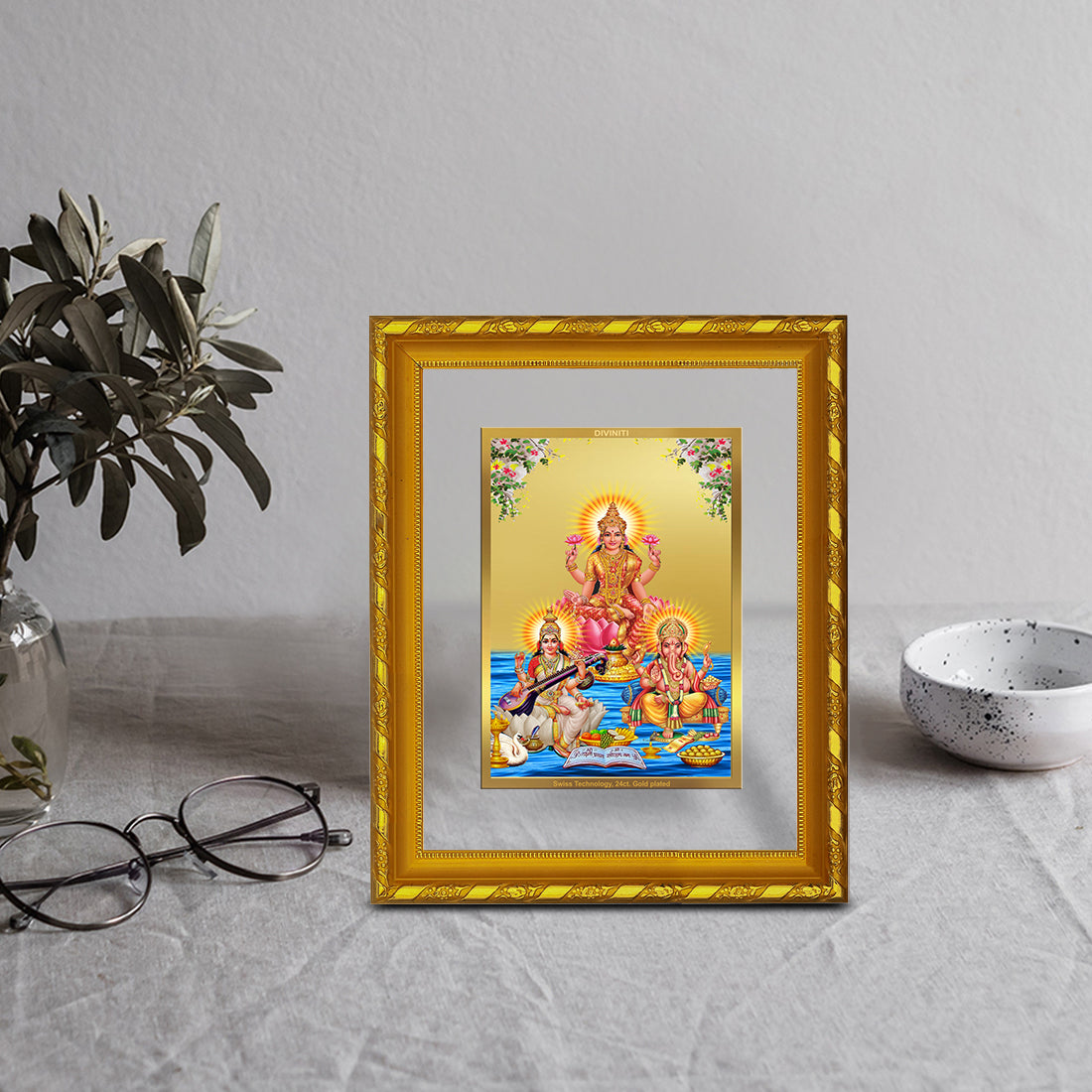 DIVINITI 24K Gold Plated Lakshmi Ganesha Saraswati Wall Photo Frame For Home Decor, Gift (21.5 X 17.5 CM)